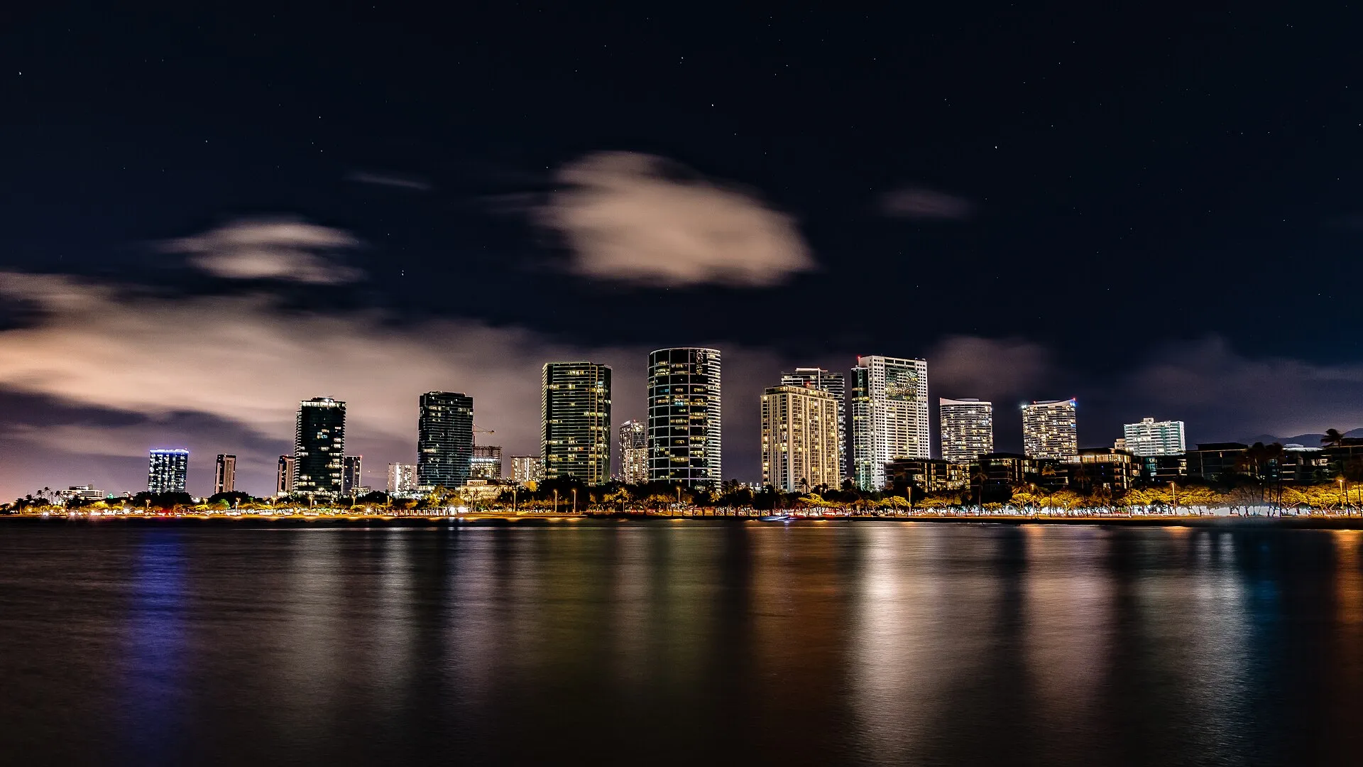 Honolulu skyline at night across the water